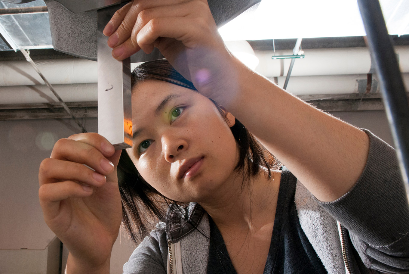 Engineering female student works inside of a lab.